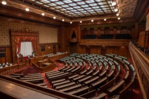 Captivating wide-angle view of a classic legislative assembly hall with ornate wood design.